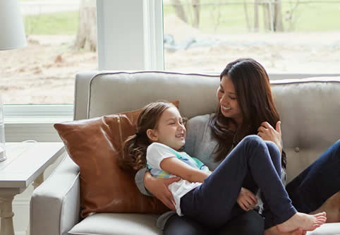 mother and daughter play at home