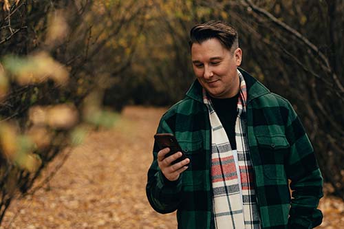 man using mobile outdoors